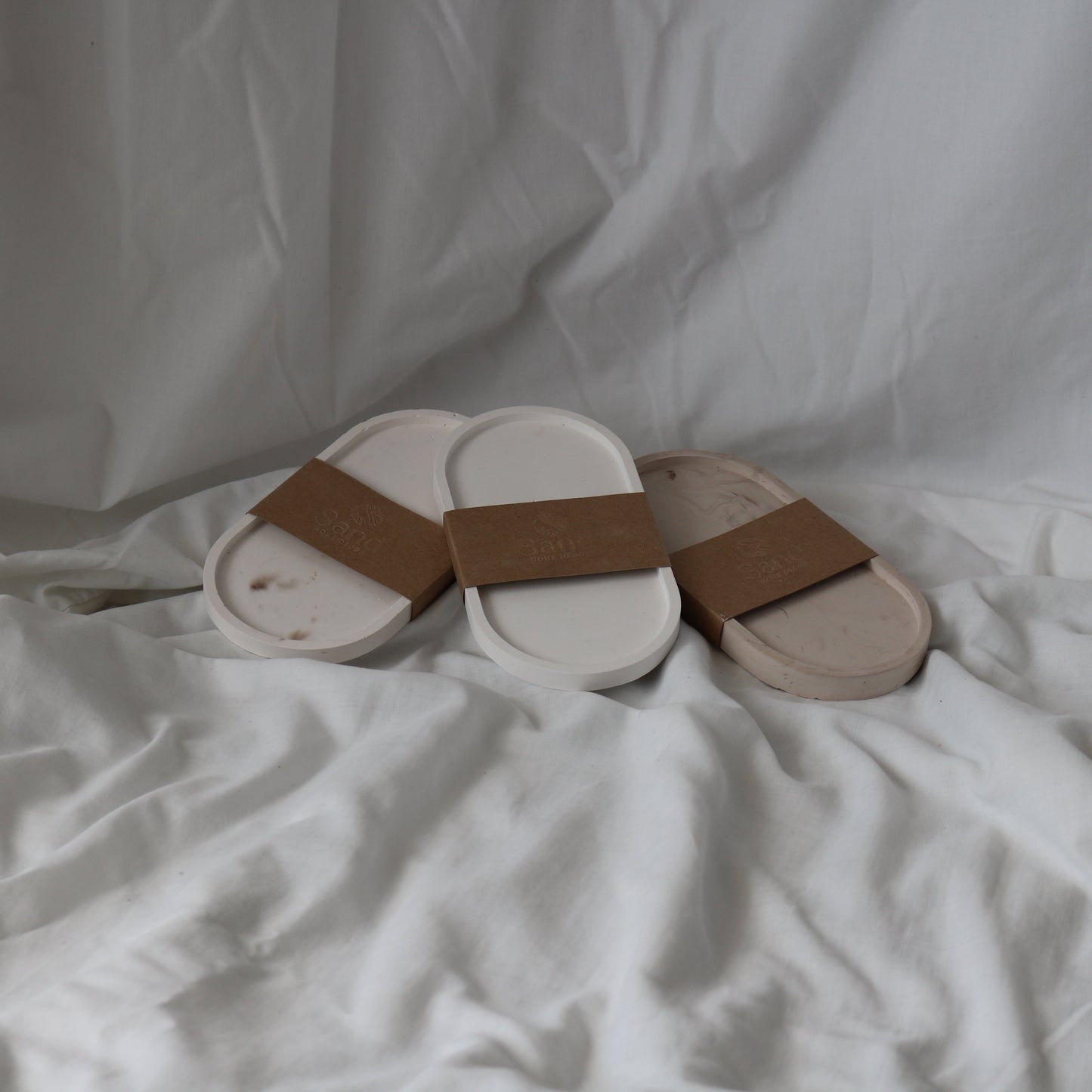 Handmade trinket tray with branded kraft paper label.