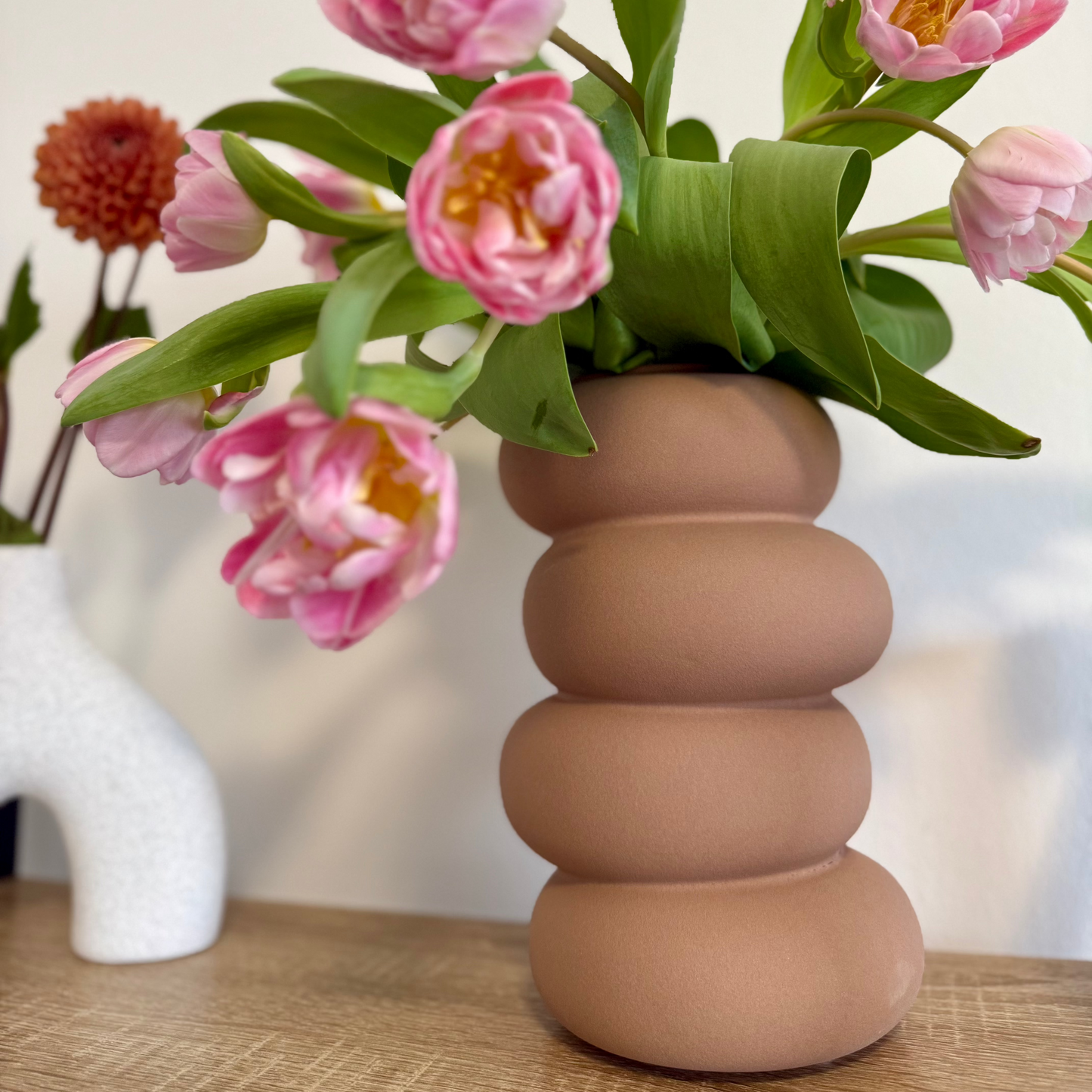 four circular stacked terracotta ceramic vase