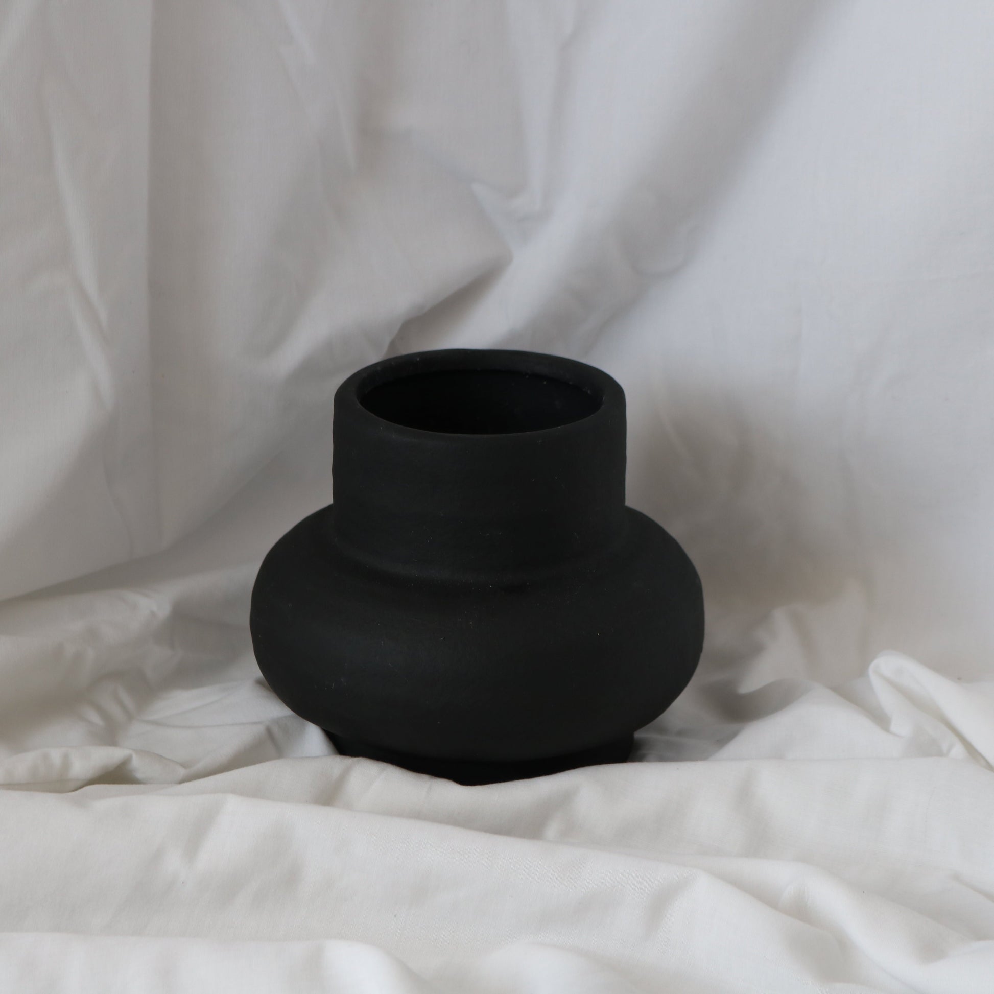 round bold black ceramic vase perfect for adding a touch of elegance into any room 