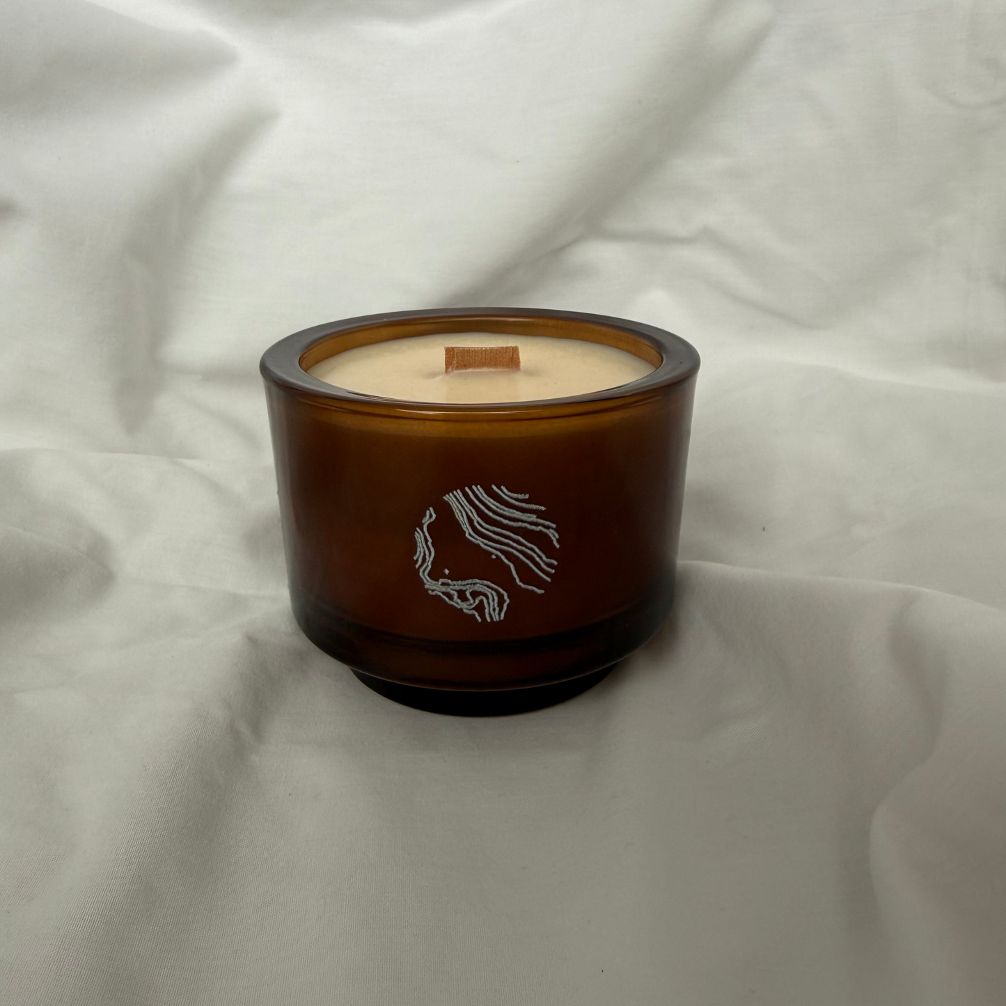 Handmade amber glass soy candle with wooden wick, luxury home decor by Sand Home Decor in Cape Town. 