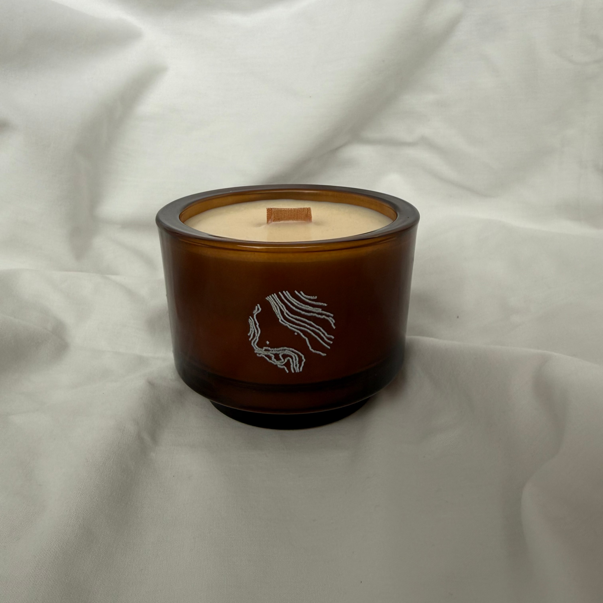 Handmade amber glass soy candle with wooden wick, luxury home decor by Sand Home Decor in Cape Town. 